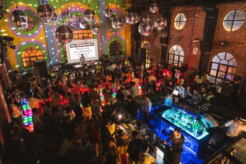 an overhead view of a crowd of people at a bar at Gaas BaasCo in Kathmandu