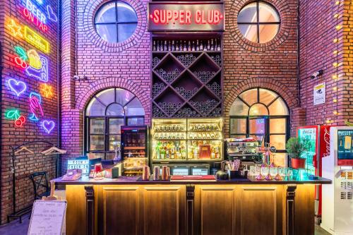 a bar in a building with neon signs on it at Gaas BaasCo in Kathmandu