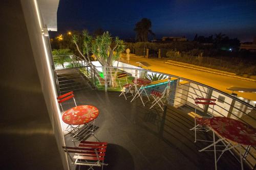 a view of a balcony with chairs and a pool at Tra Le Braccia di Morfeo in Terrasini