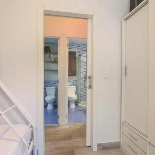 a bathroom with two toilets in a room at Spacious Villa in Guillena with Garden and Private Pool in Guillena