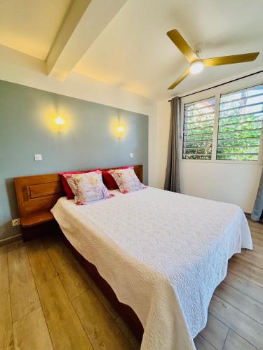 Ένα ή περισσότερα κρεβάτια σε δωμάτιο στο Residence Les Lataniers