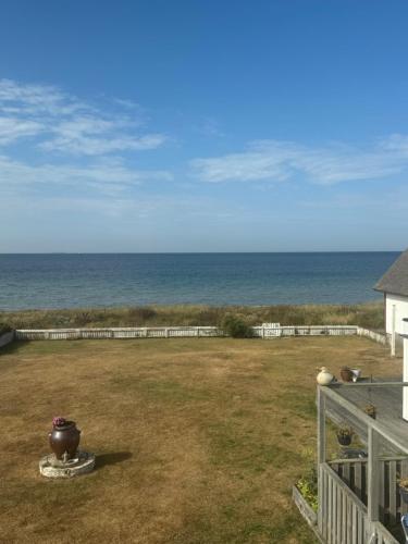a view of the ocean from the balcony of a house at Havsnära studio in Höganäs