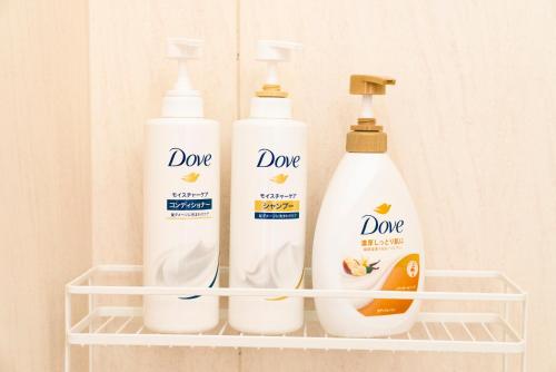 three bottles of cleaning products sitting on a shelf at Yokohama NOIE 横浜ノイエ in Yokohama
