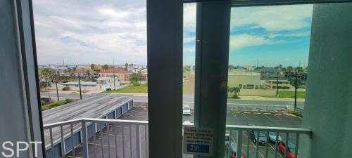 a view of a city street from a balcony at Aquarius 408 in South Padre Island