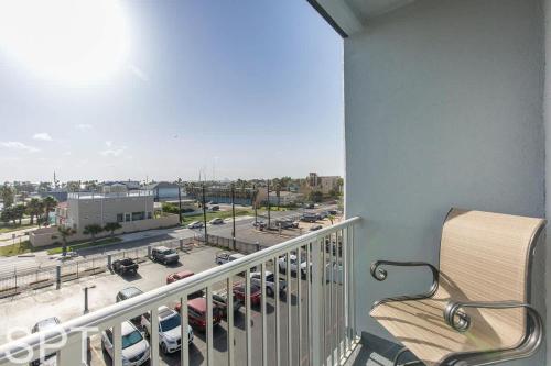 a balcony with a view of a parking lot at Aquarius 408 in South Padre Island