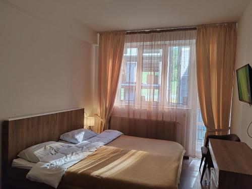 Ένα ή περισσότερα κρεβάτια σε δωμάτιο στο Tribu