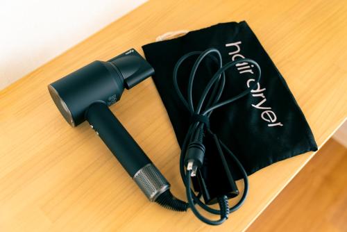 a blow dryer sitting on top of a table at Yokohama NOIE 横浜ノイエ in Yokohama