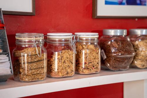 a shelf filled with jars of nuts and seeds at Casa de Hilario in Yaiza