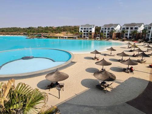 a group of umbrellas and a swimming pool at Lagoon - The Blyde in Pretoria