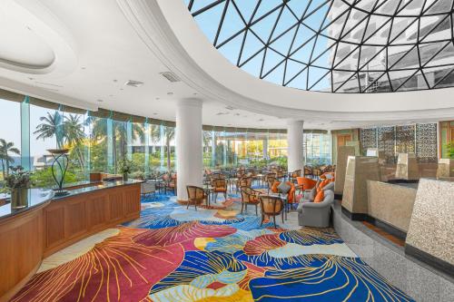 a lobby with a colorful rug on the floor at Royal Cliff Grand Hotel Pattaya in Pattaya South