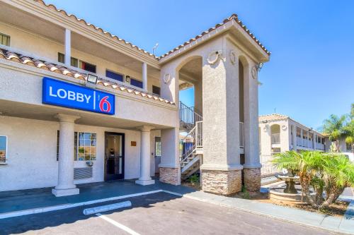 a building with a sign that reads lobby at Motel 6-Menifee, CA in Menifee