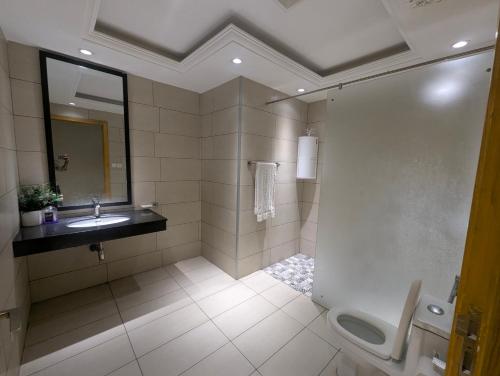 a bathroom with a shower and a sink and a toilet at Bahria heights 1 in Rawalpindi