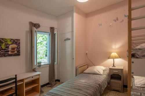 Postel nebo postele na pokoji v ubytování Chez Mémé De La Maréchale
