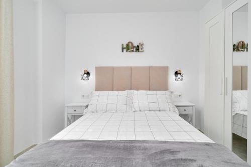 Ένα ή περισσότερα κρεβάτια σε δωμάτιο στο Apartamento Suzanne
