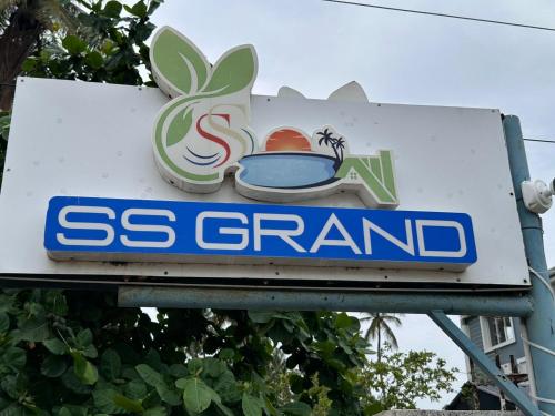 a sign for a gas station with a spider on it at SS Grand with swimming pool in Puducherry