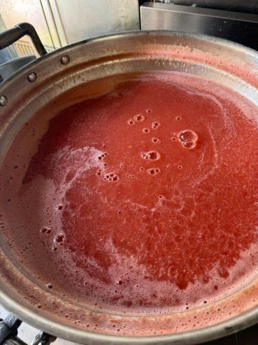 a pan filled with sauce on top of a stove at Hataya Onsen Sasa no yu in Katashina