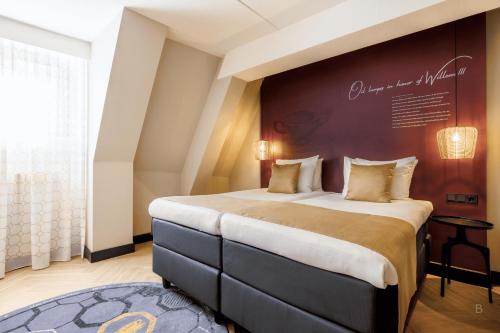 Postel nebo postele na pokoji v ubytování Hotel Die Port van Cleve