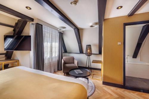 Postel nebo postele na pokoji v ubytování Hotel Die Port van Cleve