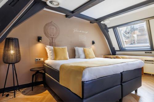Postel nebo postele na pokoji v ubytování Hotel Die Port van Cleve