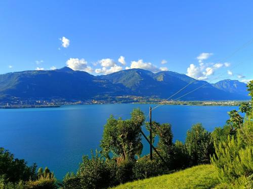 a view of a lake with mountains in the background at A Casa di Raffi by Holiday World in Pisogne