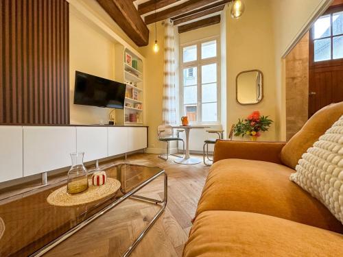 TV a/nebo společenská místnost v ubytování L'Atelier Nova