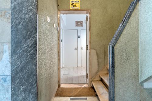 a hallway leading to a door in a building at Estrela House by Homing in Lisbon
