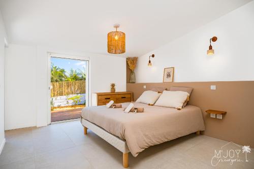 Postel nebo postele na pokoji v ubytování VILLA MAMAÔ - Élégante villa créole