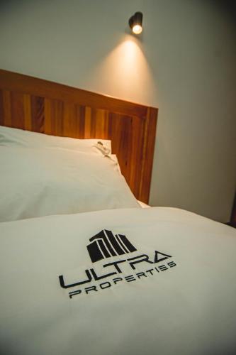 Ein Bett oder Betten in einem Zimmer der Unterkunft Ultra Aparthotel