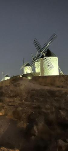 a windmill sitting on top of a hill at Finca El Pilar in Madridejos