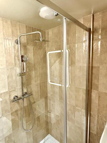 a bathroom with a shower with a glass door at Poole Quay Apartment - Perfect Location - Beatiful Roof Terrace - Free Parking in Poole