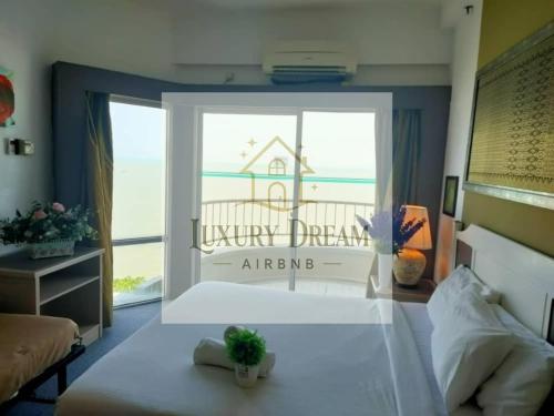 Ένα ή περισσότερα κρεβάτια σε δωμάτιο στο Luxury Dream Seaview