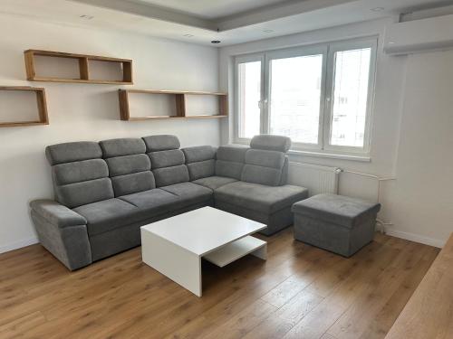 a living room with a couch and a table at Ubytovanie v Prievidzi in Prievidza