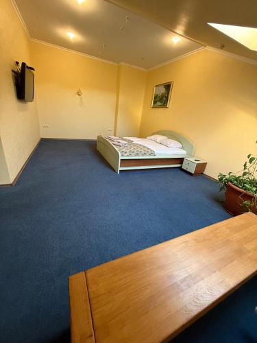 a room with a bed in the corner of a room at Sava Dream in Zhytomyr
