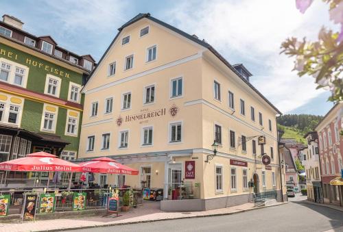 a large white building on a city street at Hotel Himmelreich in Mariazell