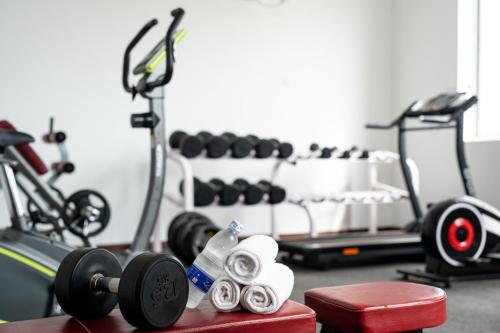 a gym with two exercise bikes and weights at Nungwi Dreams by Mantis in Nungwi