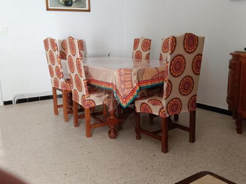 a dining room table and chairs with a table and chairsuggest at La Sirène BENI KHIAR TUNISIE AFRIQUE in Beni Khiar