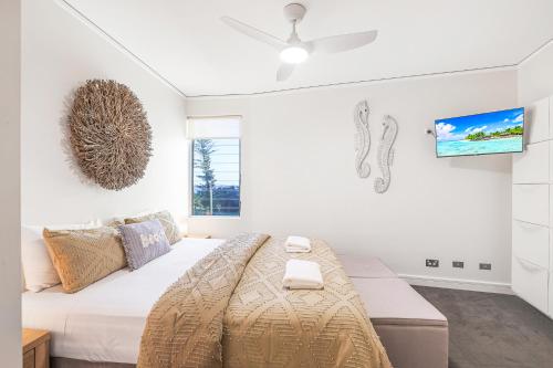 Ένα ή περισσότερα κρεβάτια σε δωμάτιο στο C Bargara Resort