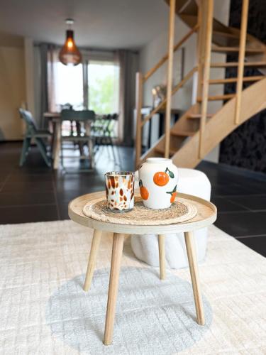 a coffee table with two cups on top of it at COCO a unique quiet home with private parking in Laarne