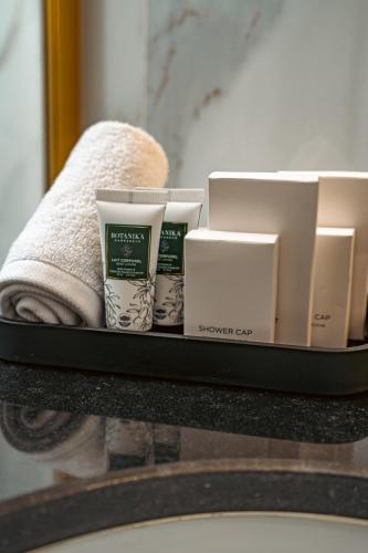 a shelf with some products on a bathroom counter at Marly Boutique Hôtel in Casablanca