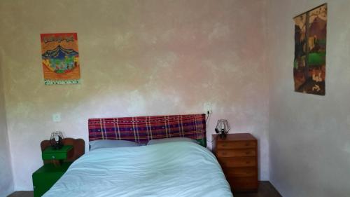 Ένα ή περισσότερα κρεβάτια σε δωμάτιο στο Chambre à la campagne