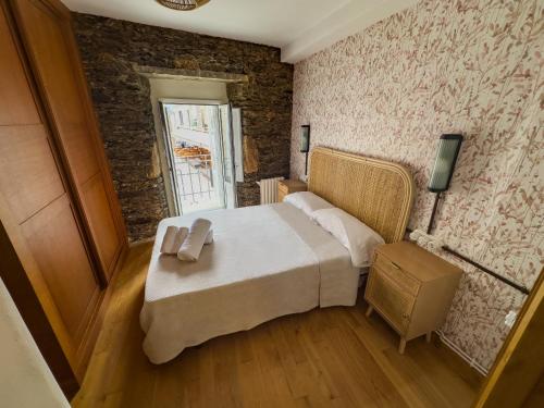 Ένα ή περισσότερα κρεβάτια σε δωμάτιο στο Go Compostela Apartamento 4 pax