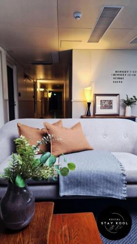 a living room with a couch and a table at Stay Kool in Kiuruvesi