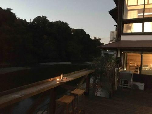 a deck with a table and chairs on a building at Kisuien - Vacation STAY 55464v in Kinokawa