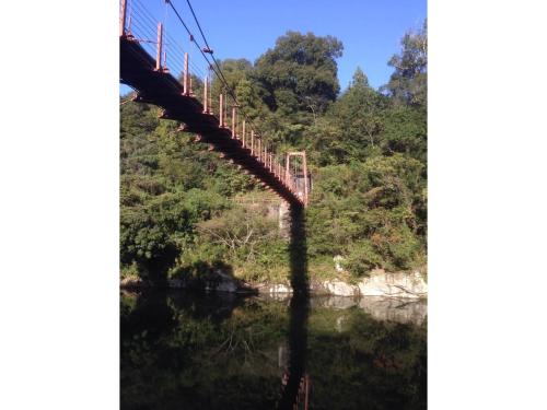 a suspension bridge over a river at Kisuien - Vacation STAY 55464v in Kinokawa