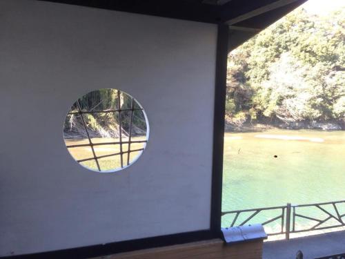 a window in a room with a view of a beach at Kisuien - Vacation STAY 55464v in Kinokawa