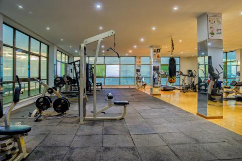 a gym with cardio equipment in a building at Bintumani in Freetown