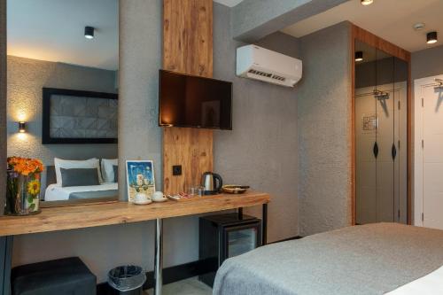 Ένα ή περισσότερα κρεβάτια σε δωμάτιο στο Mielo Lara Hotel
