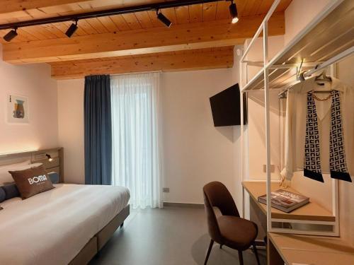 Ένα ή περισσότερα κρεβάτια σε δωμάτιο στο BOMA Prime Rooms