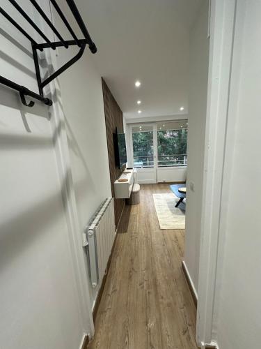 a hallway with a toilet and a sink at Eden des neige in Vars