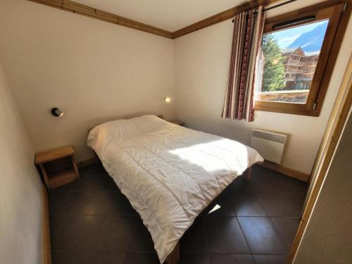 Ένα ή περισσότερα κρεβάτια σε δωμάτιο στο Résidence Le Criterium - Résidence Le Critérium 3 Chalet A Appartement 1 MAE-1993